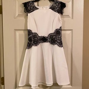 Elegant White Dress with Black Lace Overlay
